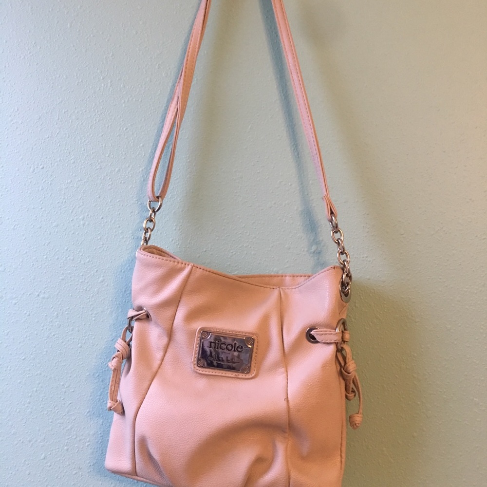 White cross body bag.